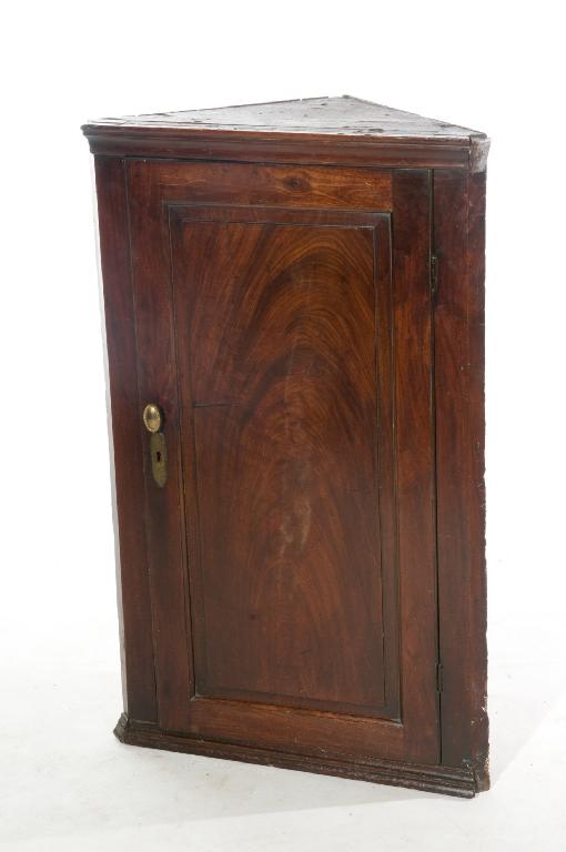 Appraisal: GEORGE III MAHOGANY HANGING CORNER CUPBOARD with solid panelled door