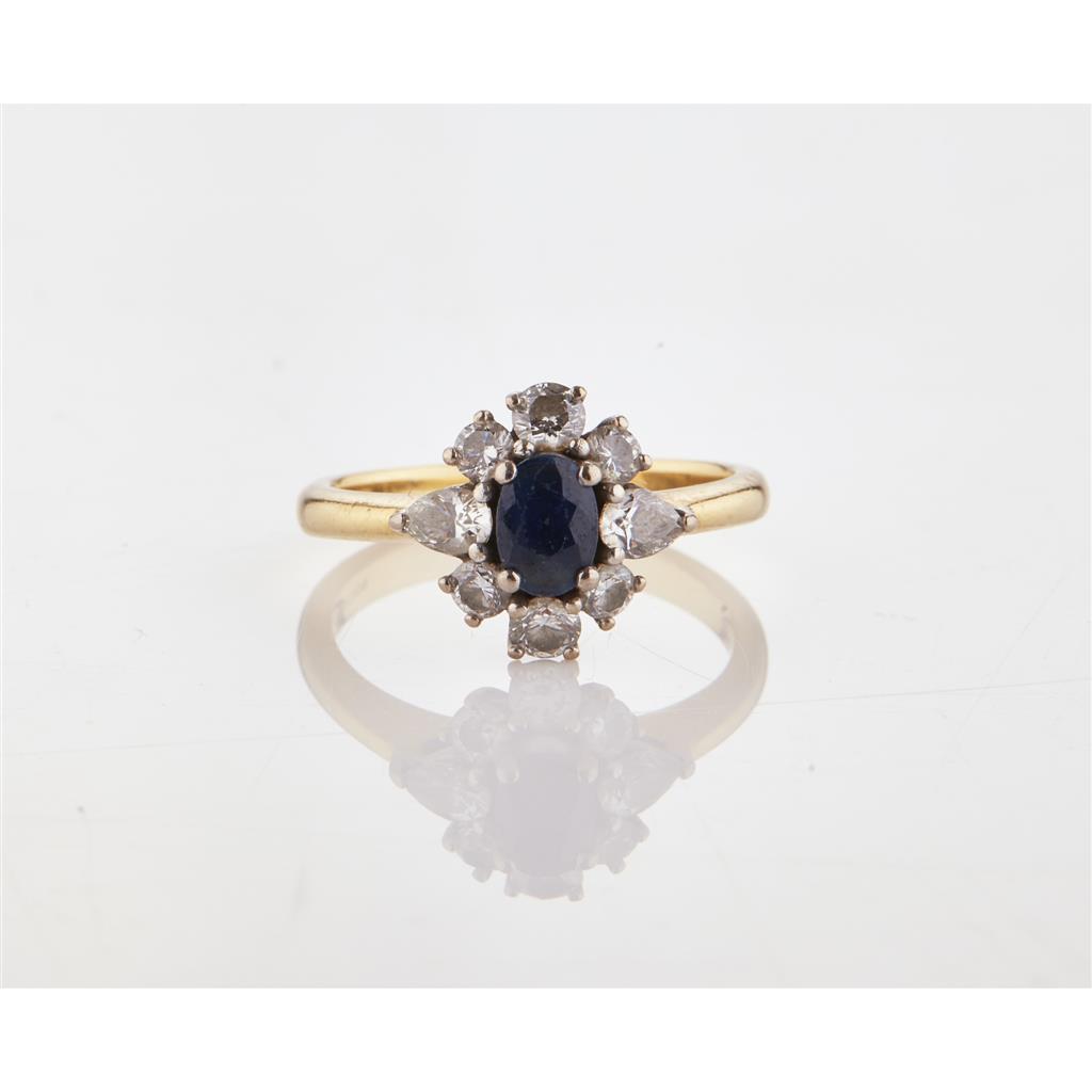 Appraisal: A sapphire and diamond set cluster ring claw set with