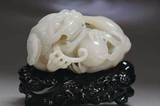 Appraisal: CARVED CELADON JADE LION Large and finely carved Chinese celadon