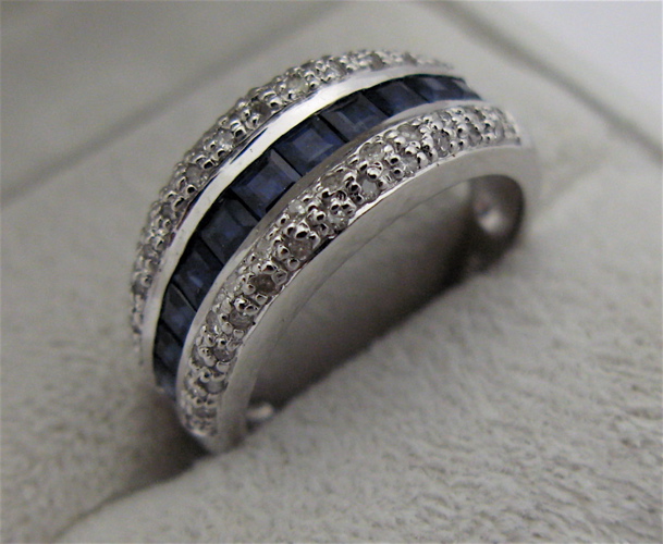 Appraisal: SAPPHIRE DIAMOND AND KARAT WHITE GOLD RING set with square-cut