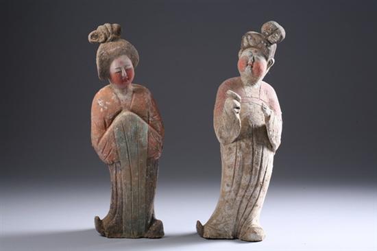 Appraisal: TWO CHINESE POLYCHROME TERRACOTTA FIGURES Tang Dynasty-style - Each in