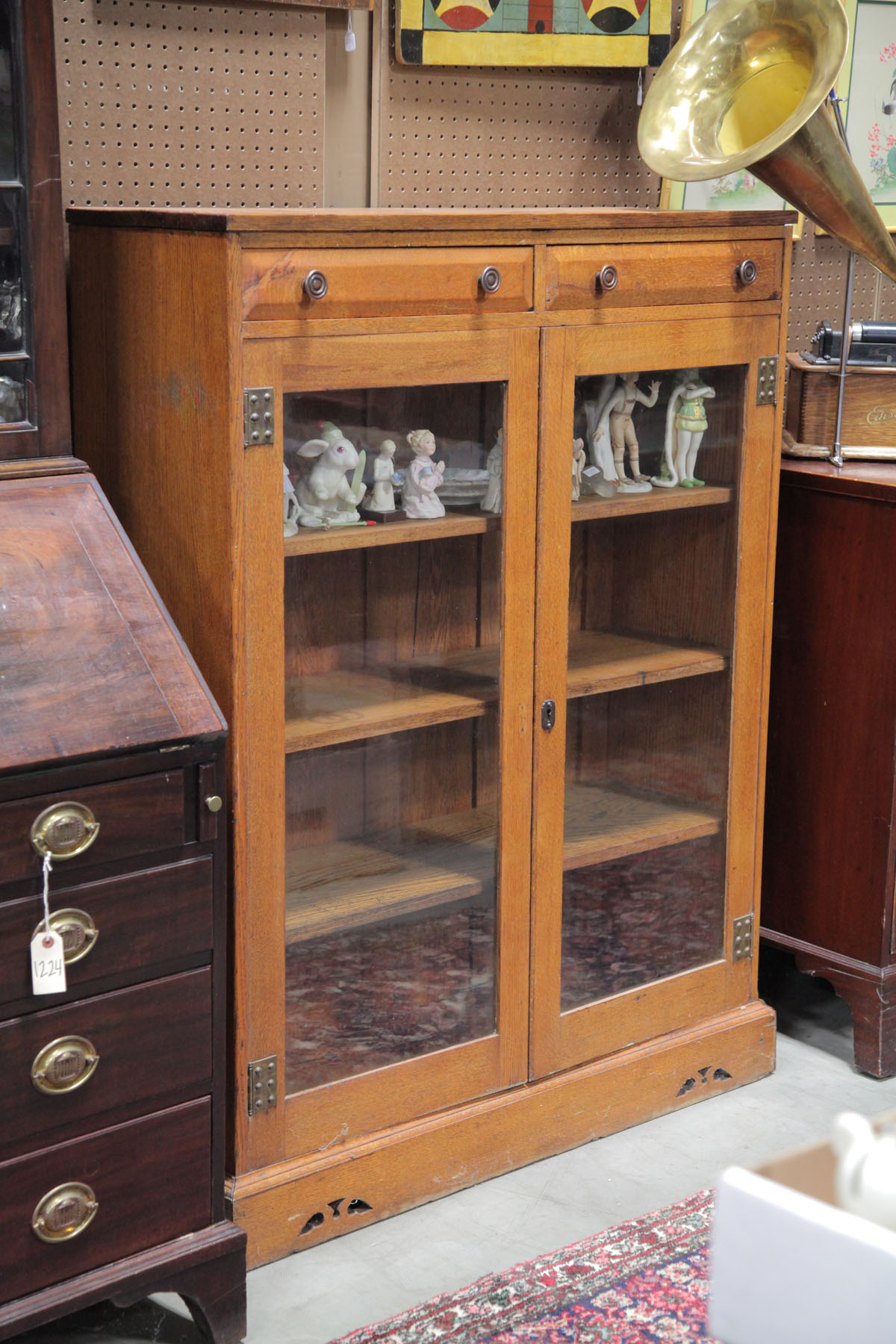 Appraisal: BOOKCASE American early th century oak with cherry secondary Light