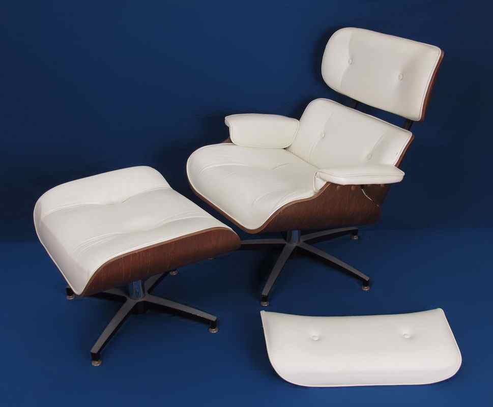 Appraisal: EAMES HERMAN MILLER STYLE LOUNGE CHAIR AND OTTOMAN White leather