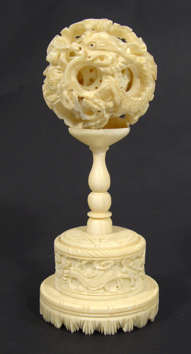 Appraisal: Oriental Ivory puzzle ball on stand profusely carved with dragons