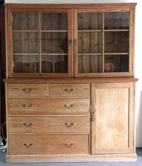 Appraisal: A pine dresser the glazed upper section over drawers and