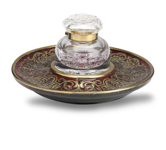 Appraisal: A Regency red tortoiseshell and cut-brass inkstand The glass well