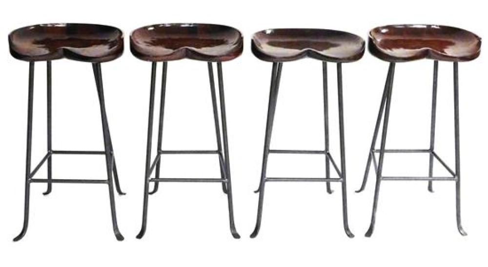 Appraisal: Set of four contemporary tall bar stools carved saddle shape