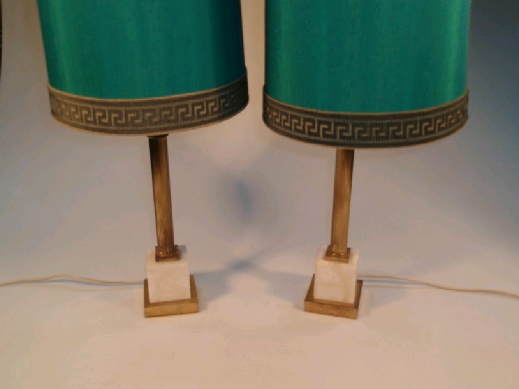 Appraisal: A pair of white marble and gilt metal table lamps