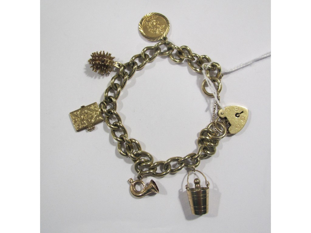 Appraisal: Nine carat gold charm bracelet with five various gold charms