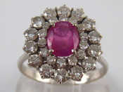 Appraisal: A white metal tests carat gold diamond and ruby ring