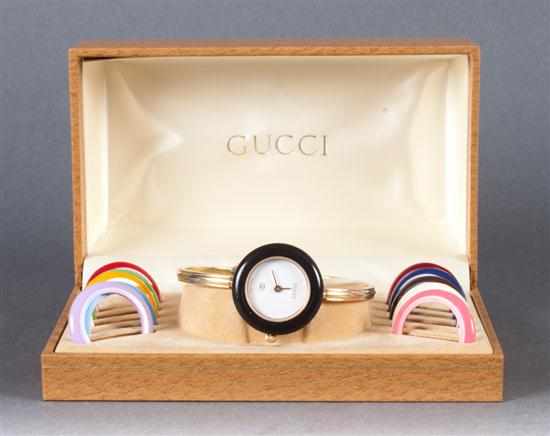 Appraisal: Gucci gilt-metal wrist watch with changeable bezel covers circa with