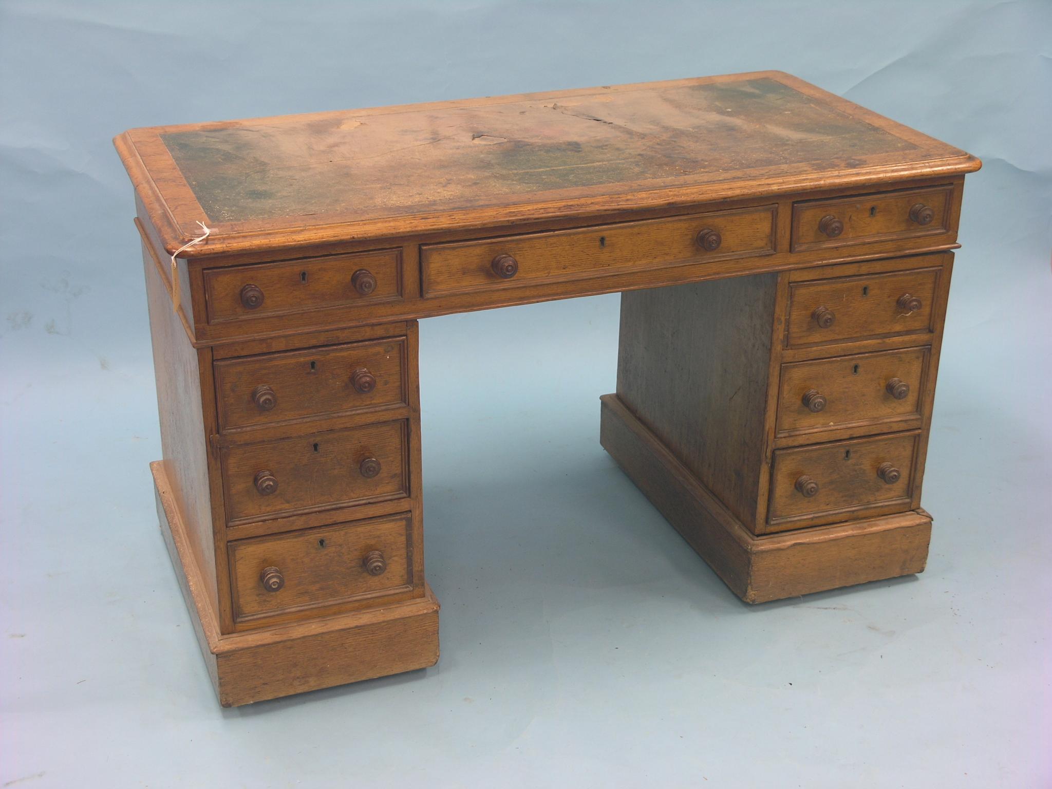 Appraisal: A Victorian oak pedestal desk inset leather top above three