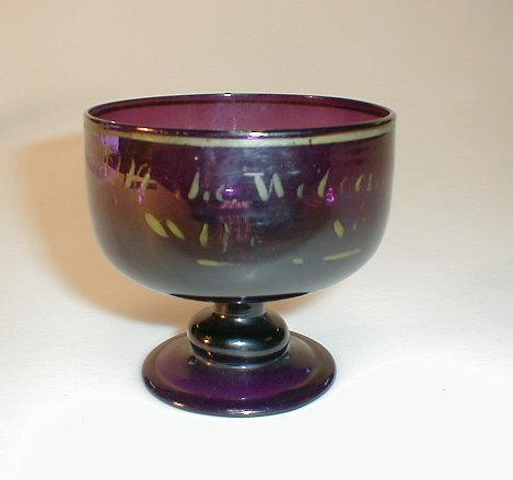 Appraisal: A Newcastle amethyst glass sundae dish with folded foot and