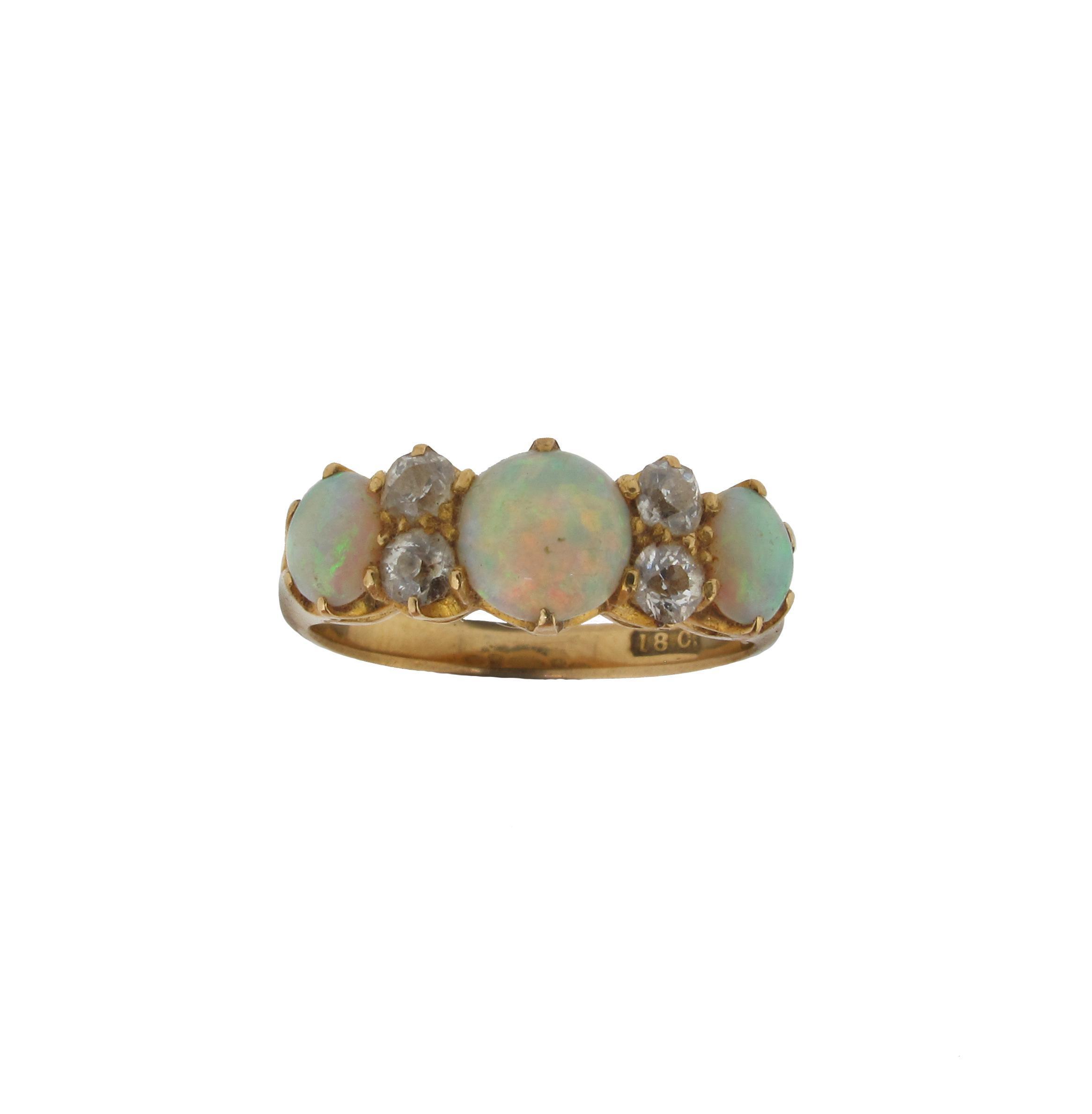 Appraisal: An opal and diamond seven stone ring