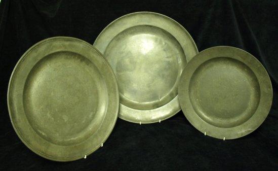 Appraisal: Two large pewter dishes with incised borders initialled beneath together