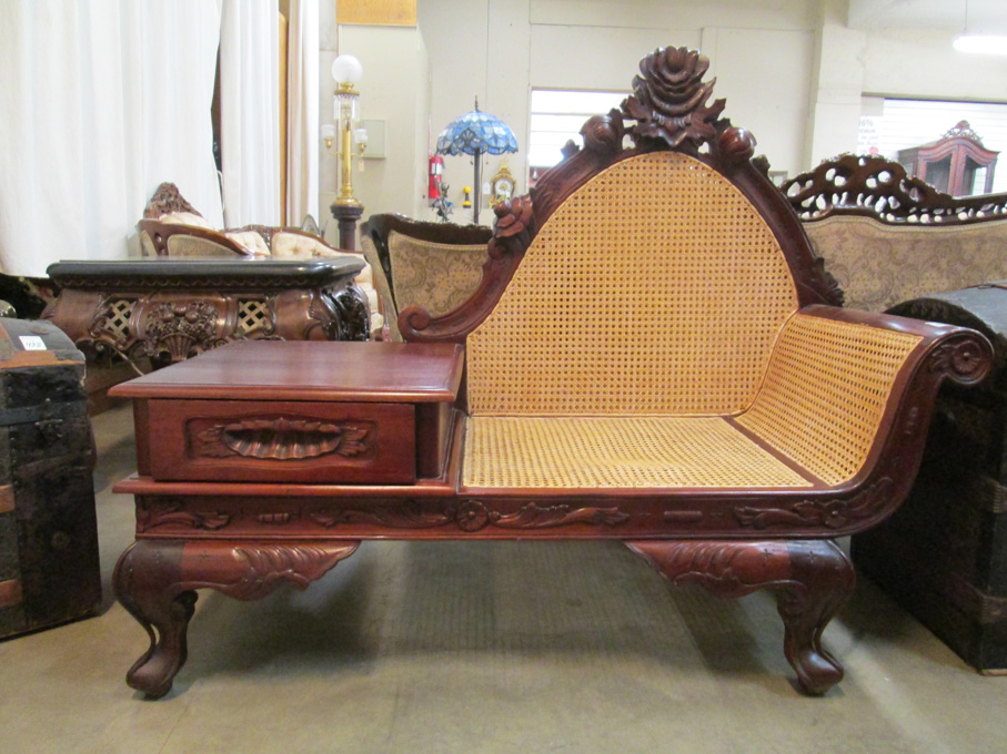 Appraisal: VICTORIAN STYLE CARVED MAHOGANY TELEPHONE SETTEE Indonesian th century hand