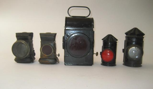 Appraisal: An oil fired lantern light black japanned with red lens