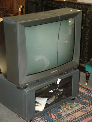 Appraisal: A Panasonic television on stand together with a Panasonic video