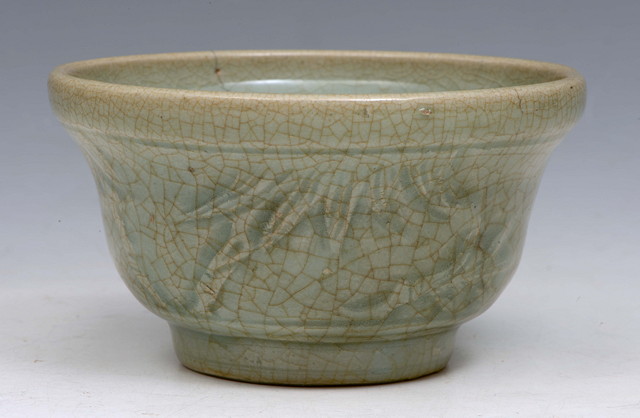 Appraisal: A CHINESE CELADON PORCELAIN BOWL with slight relief to the