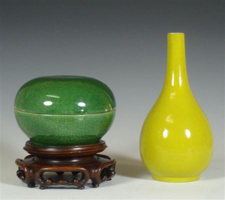 Appraisal: A Chinese monochrome yellow glazed bottle vase cm high together