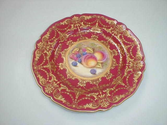 Appraisal: A Royal Worcester cabinet plate with pink border enriched in