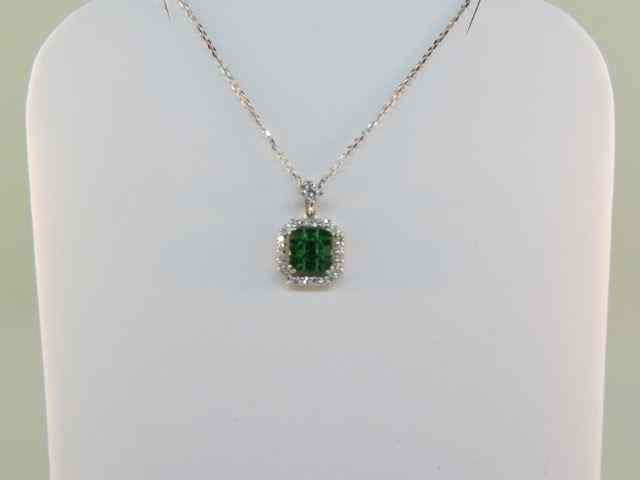 Appraisal: Tsavorite Garnet Diamond Pendant carat of rich green gems surrounded