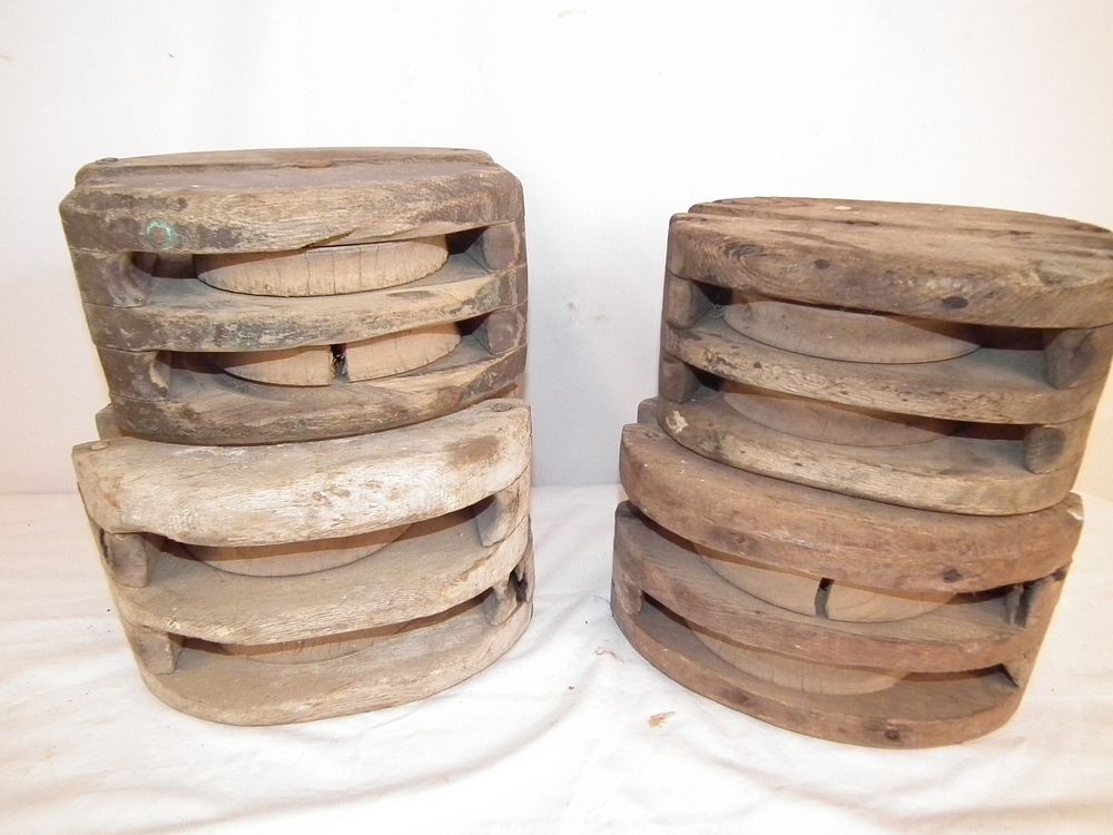 Appraisal: ANTIQUE PULLEY BLOCKS Antique wood ship's pulley blocks about in