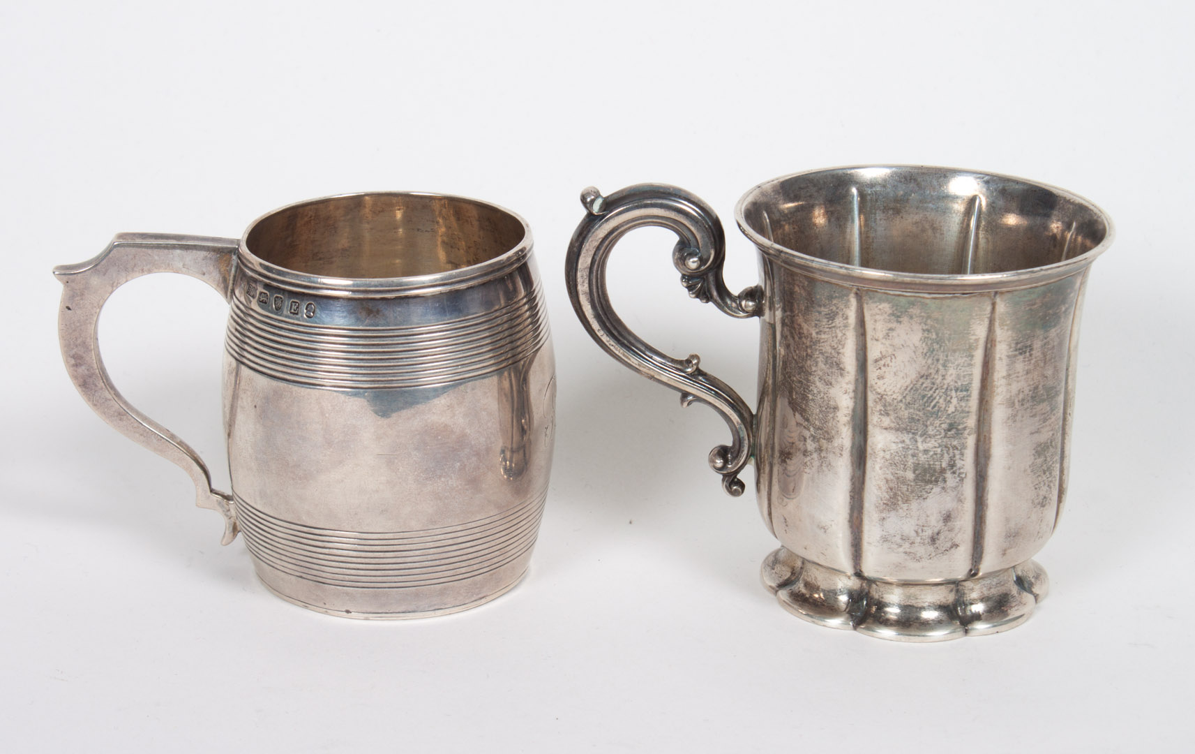 Appraisal: Two English sterling silver canns one with marks of Thomas