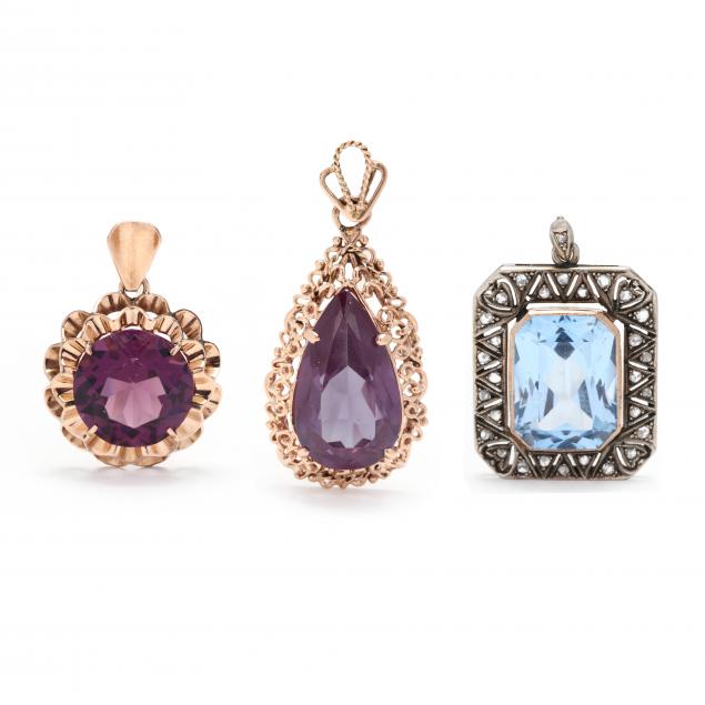 Appraisal: THREE GEM-SET PENDANTS To include a vintage pendant with a