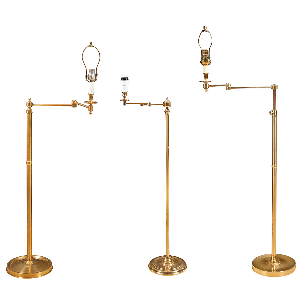 Appraisal: Group of Three Brass Standing Lamps Each with adjustable swing