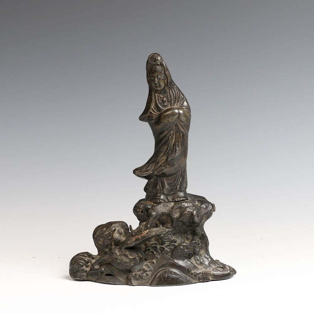 Appraisal: CHINESE BRONZE STANDING GUANYIN STATUE The Guanyin figure is shown