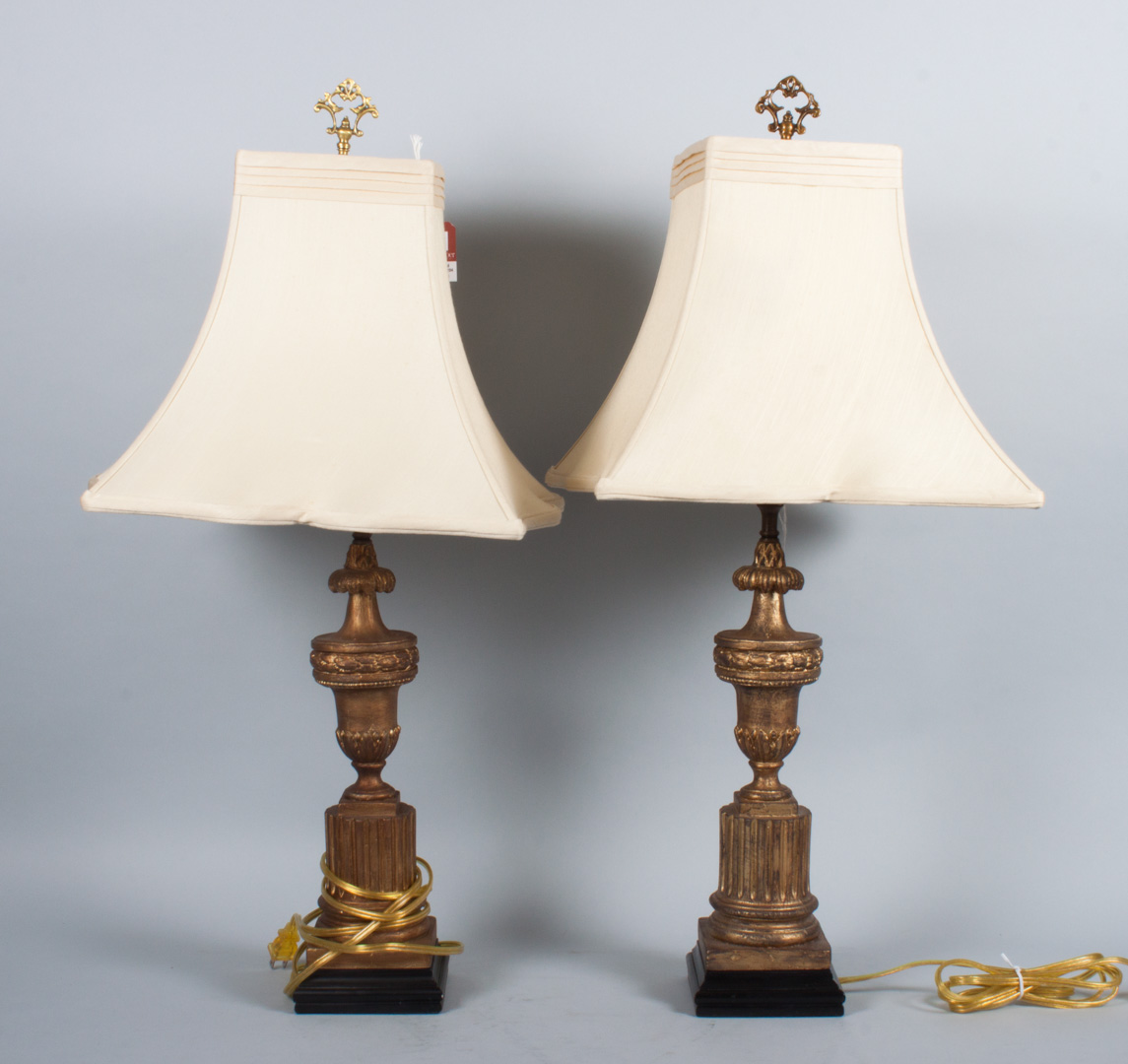 Appraisal: Pair of Classical style giltwood urn lamps with shades in