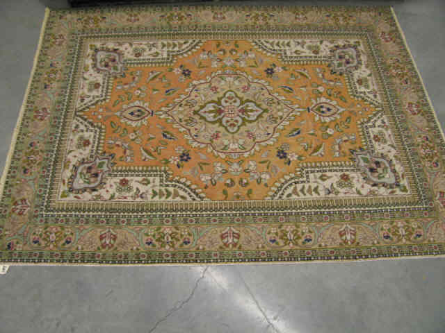 Appraisal: Tabriz Persian Handmade Rug soft pastels with green trim elaborate