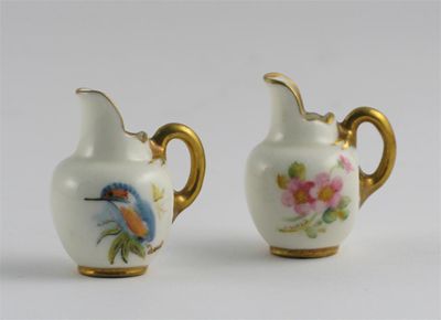 Appraisal: Two Royal Worcester miniature jugs one painted with dog roses