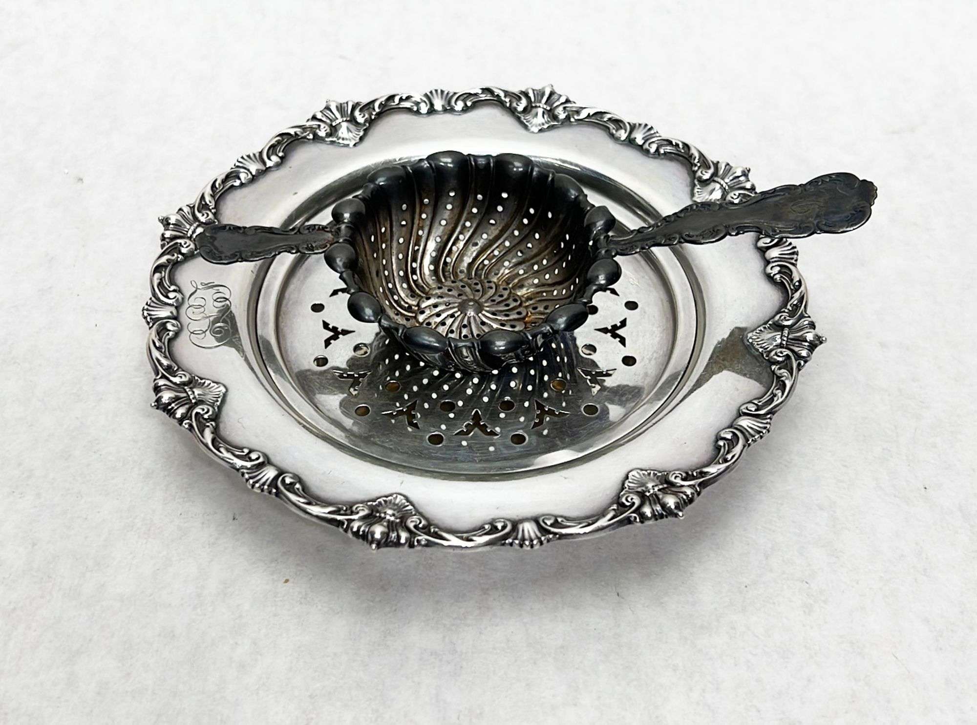 Appraisal: Sterling Silver Tea Strainer and Butter Plate ozt