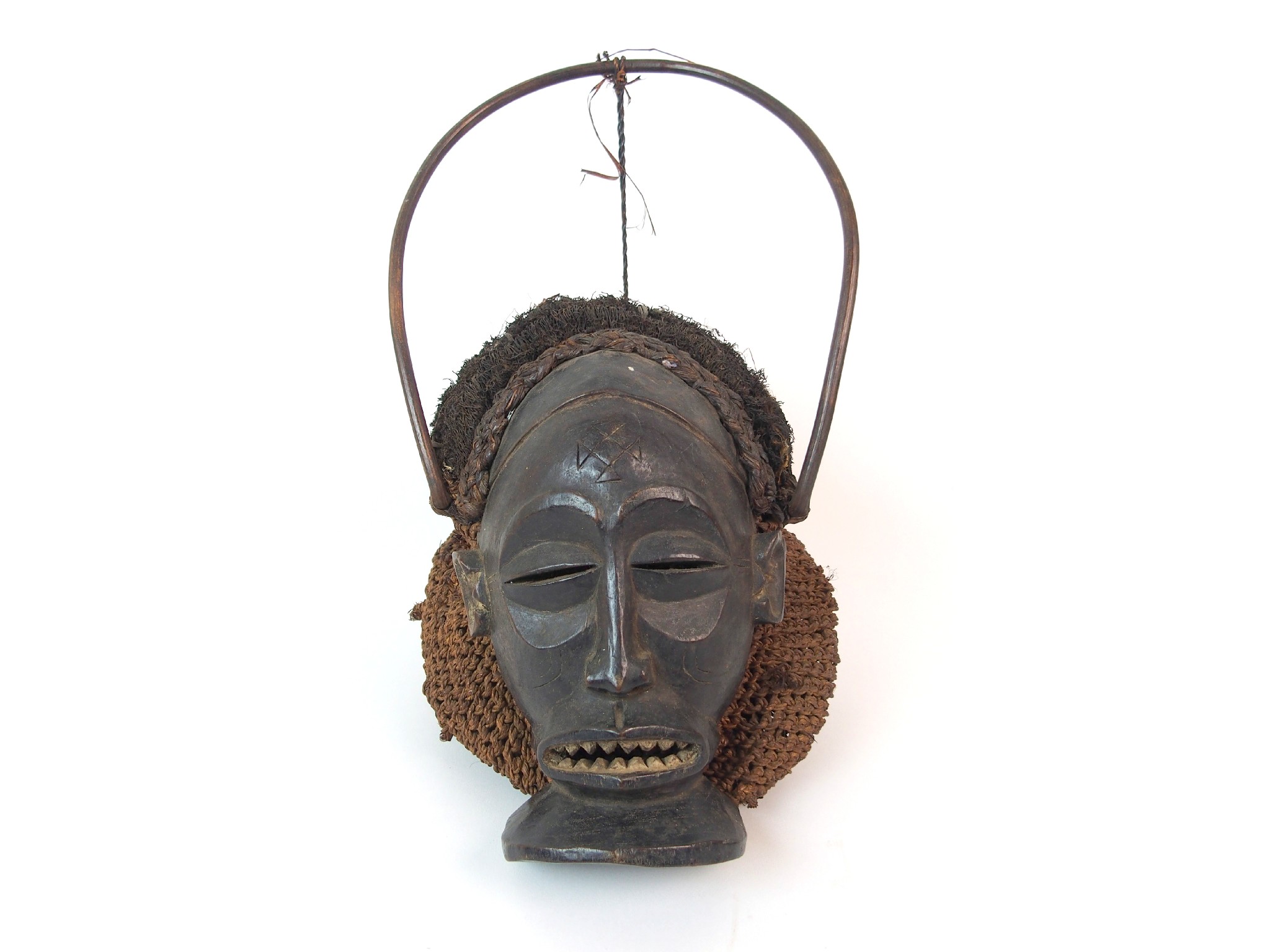 Appraisal: An African carved wood hair and wicker maskwith bentwood headdress