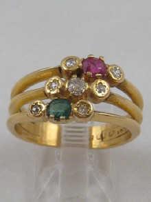 Appraisal: An carat gold diamond ruby and emerald triple band ring