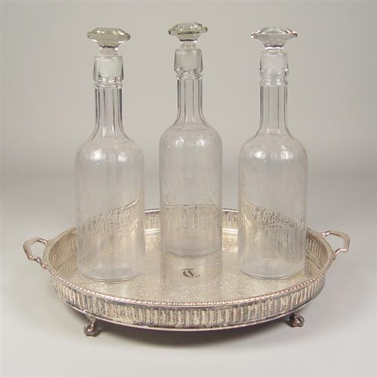 Appraisal: Decanter Set Circa Three glass decanters with cut vertical design