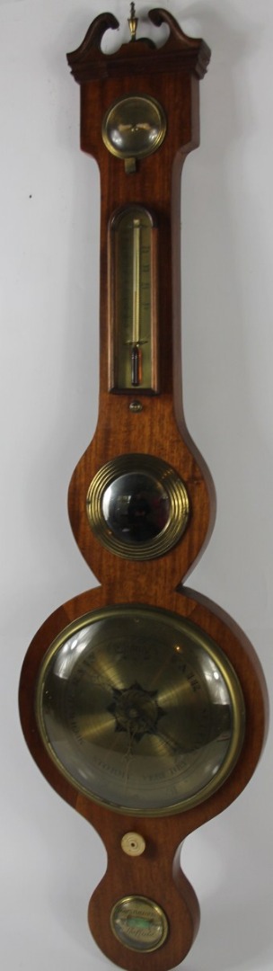 Appraisal: An early thC mahogany wheel barometer with swan neck pediment