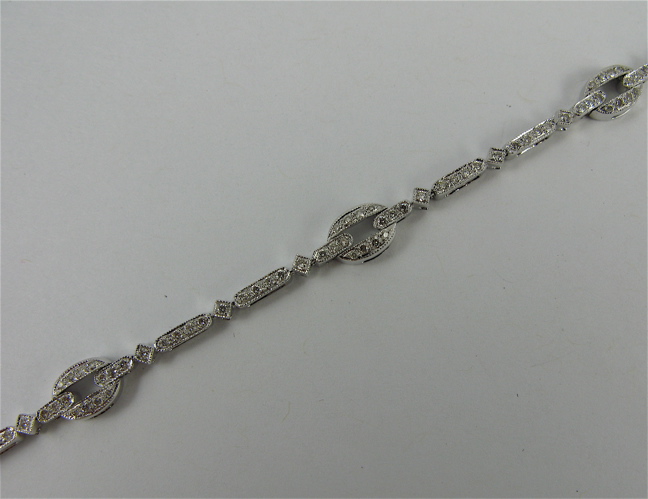 Appraisal: DIAMOND AND K WHITE GOLD BRACELET in length and covered