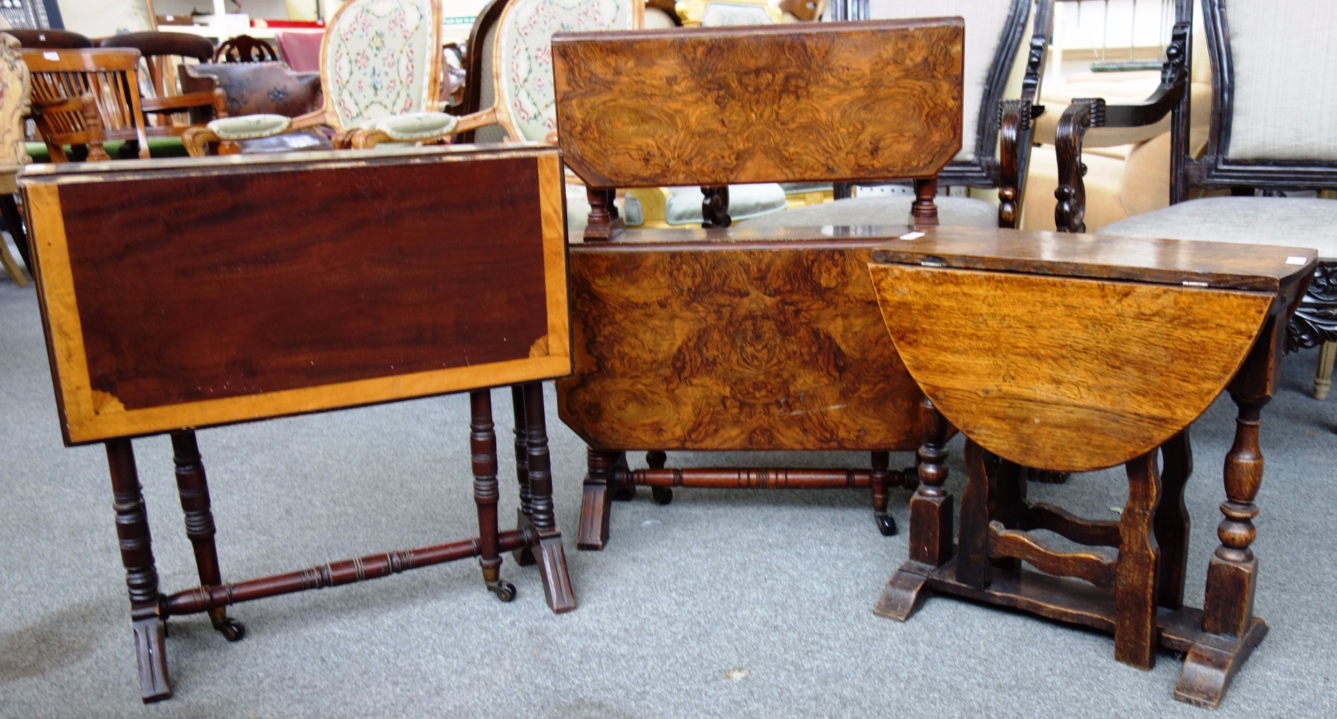 Appraisal: A Victorian figured walnut two tier Sutherland table cm wide