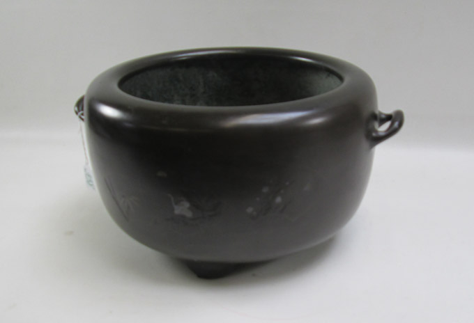 Appraisal: JAPANESE BRONZE HIBACHI tri-footed with incised decorations and split handled