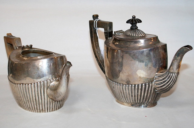 Appraisal: A LATE VICTORIAN OVAL SILVER TEAPOT with a fluted lower