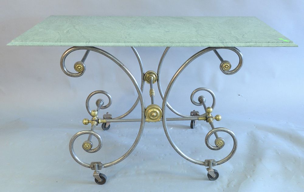 Appraisal: Baker table having iron and brass base green granite rectangular