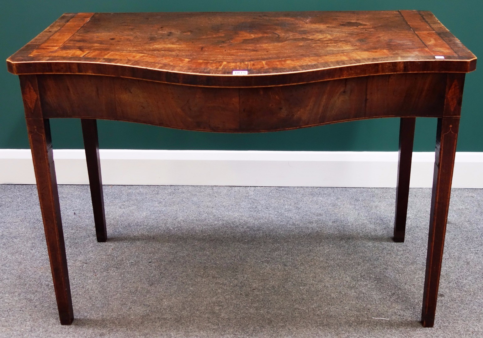 Appraisal: An th century inlaid and crossbanded mahogany serpentine serving table