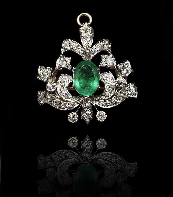 Appraisal: CT EMERALD AND CTW DIAMOND PENDANT BROOCH CA - k