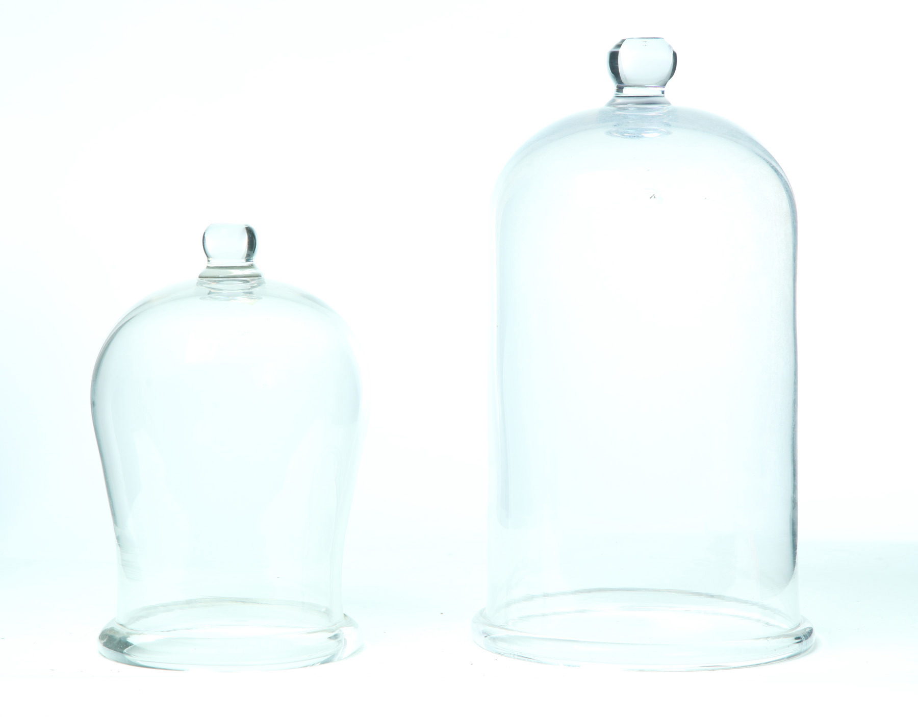 Appraisal: TWO GLASS DOMES American nd half- th century Clear glass