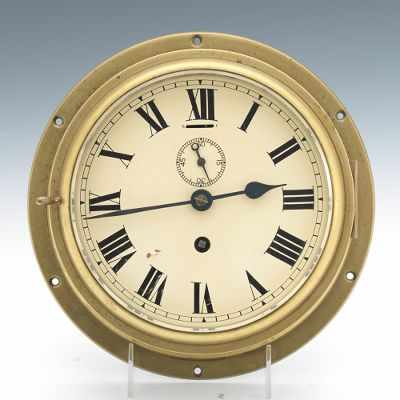 Appraisal: A Brass Ships Clock Heavy brass case cream color dial