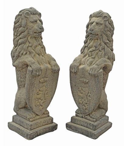 Appraisal: pair Cast stone garden statuary depicting heraldic lions standing on