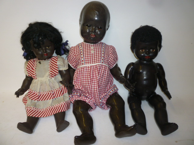 Appraisal: A Pedigree plastic black baby doll with brown glass sleeping